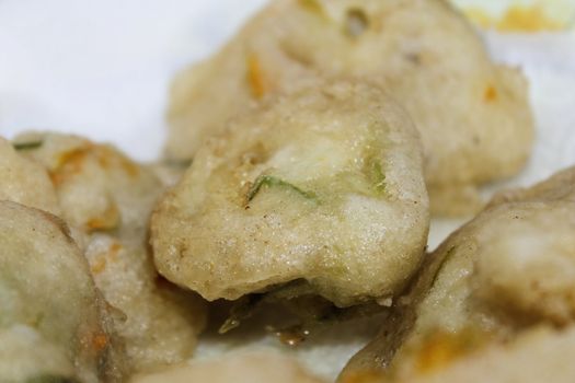 zucchini flowers in batter with mozzarella and anchovies