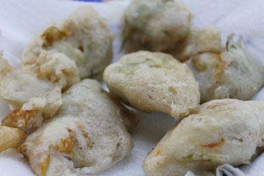 zucchini flowers in batter with mozzarella and anchovies