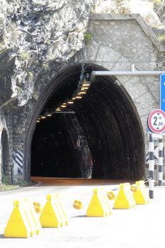 Scenic panoramic beltway road around lake Garda full of tunnels and galleries made in the rocks at the edge of a coastline