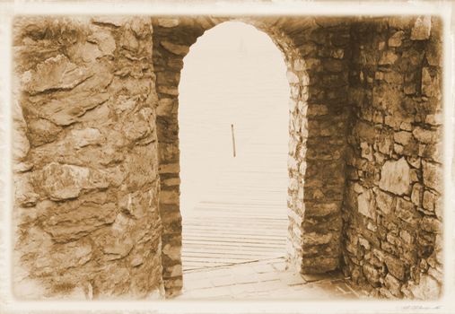 ancient stone gate on the lake in Italy