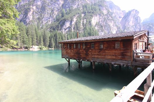 Wooden hut on lake Braies, Dolomites, Italy