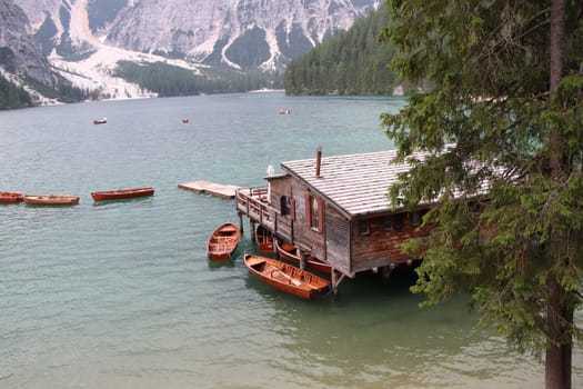 Wooden hut on lake Braies, Dolomites, Italy