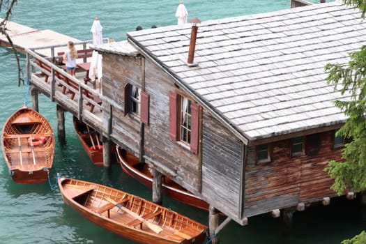 Wooden hut on lake Braies, Dolomites, Italy