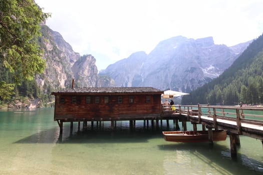 Wooden hut on lake Braies, Dolomites, Italy