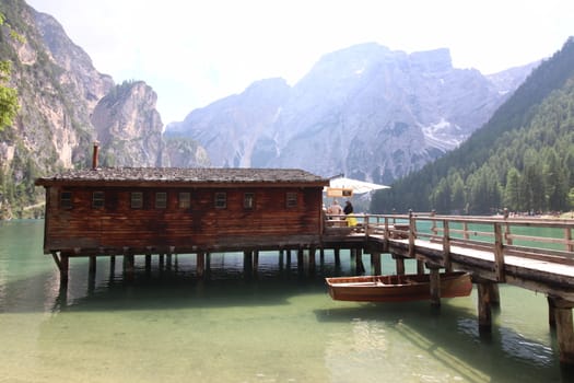 Wooden hut on lake Braies, Dolomites, Italy