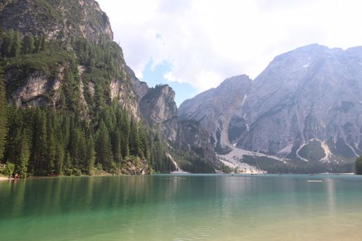 Braies lake turquoise water and Dolomites Alps view, South Tyrol region of Italy