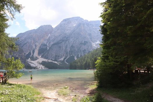 Braies lake turquoise water and Dolomites Alps view, South Tyrol region of Italy