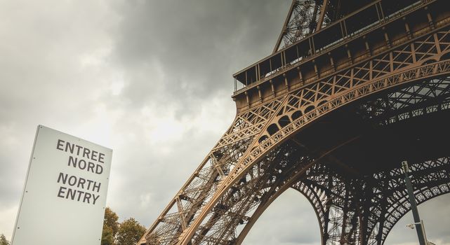 sign indicates the north entry of the Eiffel tower in Paris, France