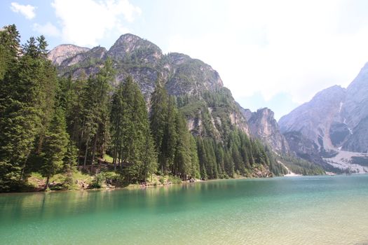 Braies lake turquoise water and Dolomites Alps view, South Tyrol region of Italy