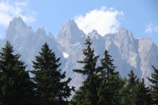 Rocky mountains with green forests at Lago di Braies. Braies lake in the Dolomites in South Tyrol, Italy, a municipality of Braies, in the Prague Valley.