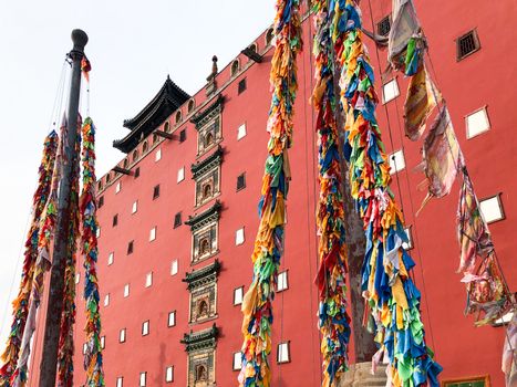 Buddhist color prayer flags at The Putuo Zongcheng Buddhist Temple, one of the Eight Outer Temples of Chengde, built in 1767 and modeled after the Potala Palace of Tibet. Chengde, China