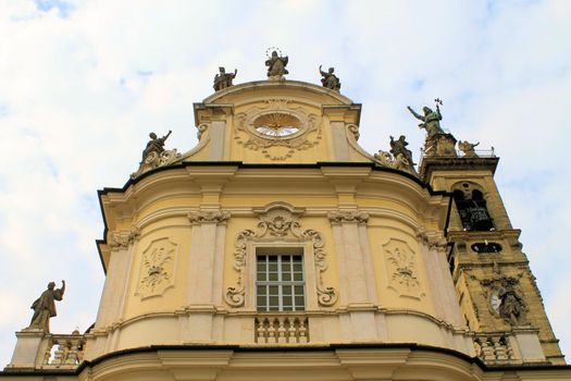 Golden Statue at Top of Church in Bergamo Italy