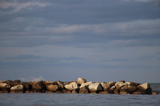 Rocks to protect the coast in the Adriatic sea in Italy