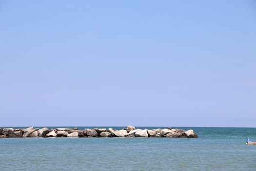 Rocks to protect the coast in the Adriatic sea in Italy