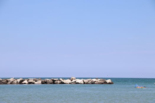 Rocks to protect the coast in the Adriatic sea in Italy