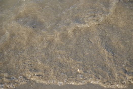 view of the blue ocean waves on the beach.