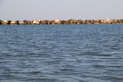 Rocks to protect the coast in the Adriatic sea in Italy