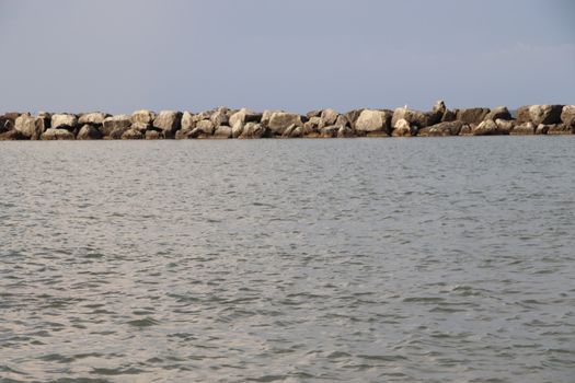 Rocks to protect the coast in the Adriatic sea in Italy