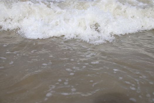 view of the blue ocean waves on the beach.