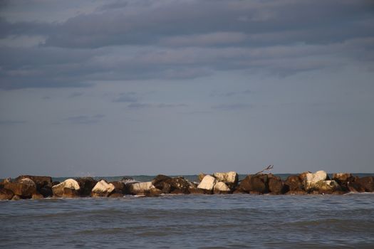 Rocks to protect the coast in the Adriatic sea in Italy