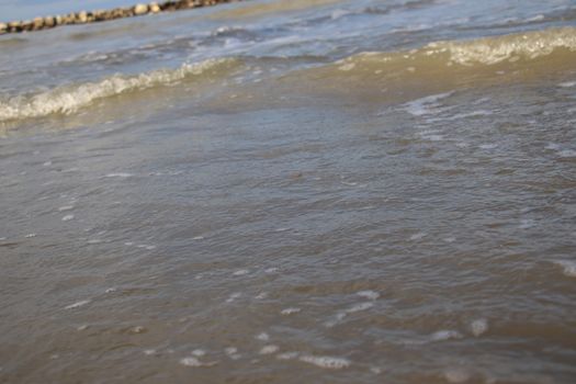 view of the blue ocean waves on the beach.