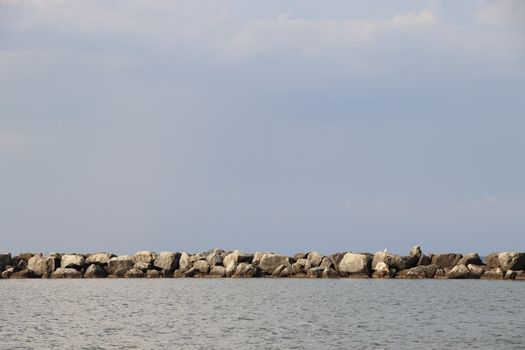 Rocks to protect the coast in the Adriatic sea in Italy