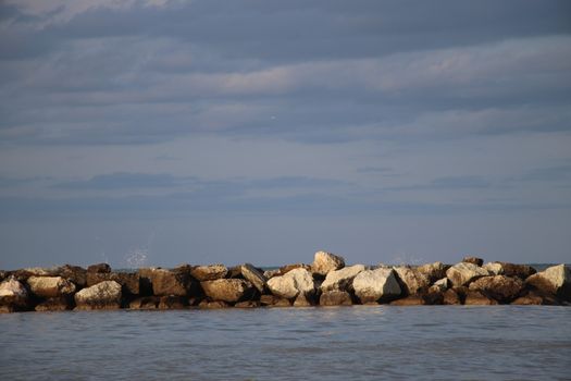 Rocks to protect the coast in the Adriatic sea in Italy