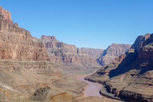 Picturesque landscape view of Grand Canyon National Park with Colorado river during sunny day. Arizona, USA. Famous travel destination.