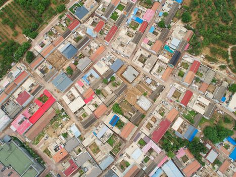 Aerial view top view of small village with little courtyard and farm style house in the country side area of Huaibei next the mountain, China