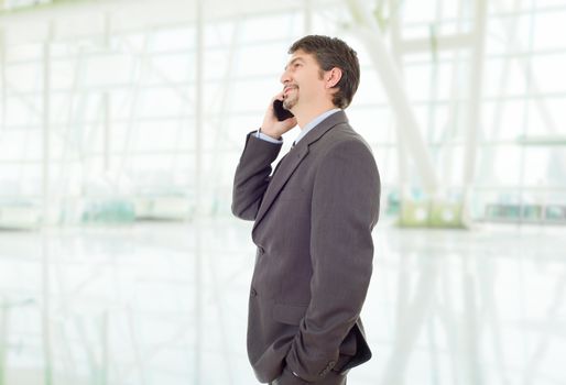 happy business man on the phone, at the office