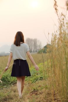 Young woman in wheat