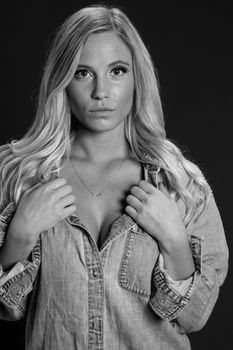 A gorgeous blonde model posing in a studio environment