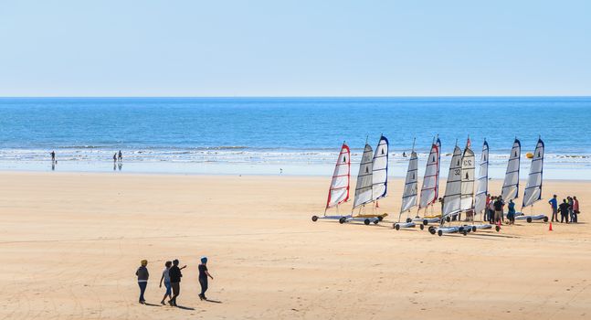 Saint Jean de Monts, France - September 23, 2017 : group of people taking a lesson of sand yachting on the beach at the end of summer