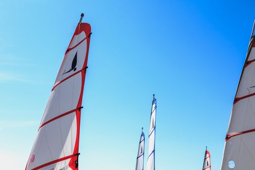 Saint Jean de Monts, France - September 23, 2017 : closeup on sails of sand yacht on blue sky on a summer day