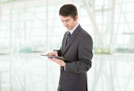 businessman using touch pad of tablet pc, at the office