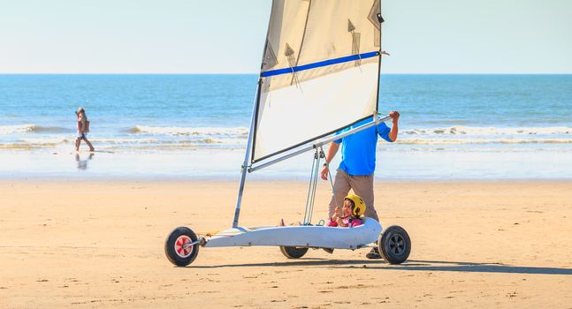 Saint Jean de Monts, France - September 23, 2017 : trainer gives a lesson of sand yachting at the beach at the end of the summer