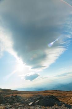 Large cloud over Mount Washington landscape in New Hampshire USA in vertical composition.