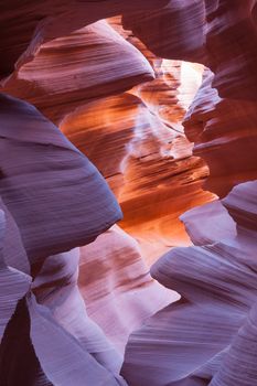 Abstract patterns of Lower Antelope Canyon gap between geological forms in USA in vertical composition.