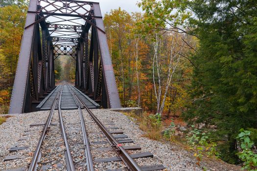 Steel truss railway bridge across Sawyer River at Bears Notch on Kancamagus Highway, New Hampsire USA.