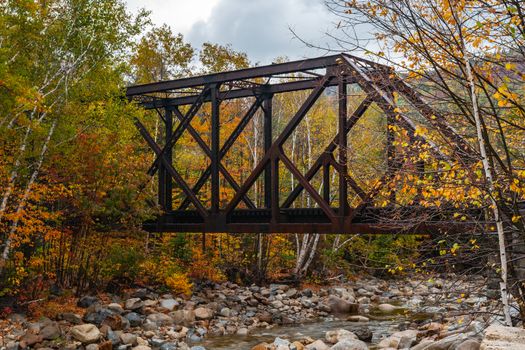 Steel truss railway bridge across Sawyer River at Bears Notch on Kancamagus Highway, New Hampsire USA.