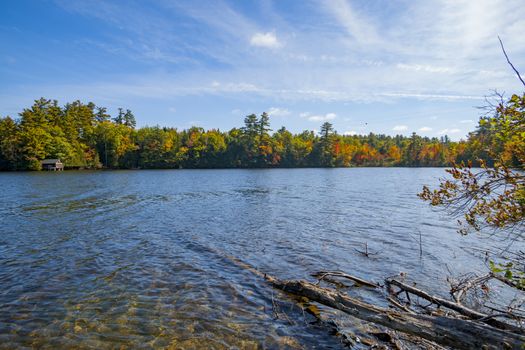 Beautiful autumn colors of surrounding woodlands of Lake Echo, Maine, USA. Highway 17.