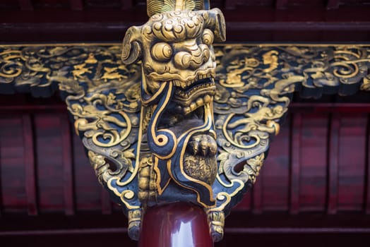 Stone dragon sculpture on a buddhist temple wall in Chengdu, Sichuan province, China