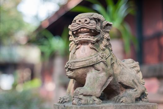 Lion stone statue in a buddhist temple, Chengdu, China