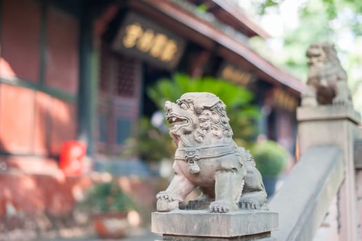 Lion stone statue in a buddhist temple, Chengdu, China