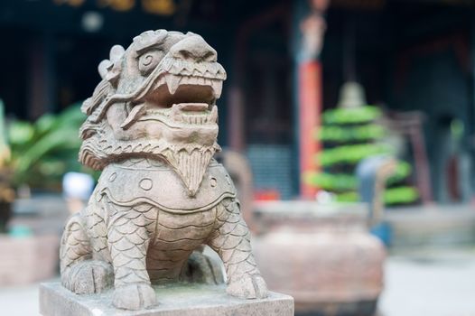 Lion stone statue in a buddhist temple, Chengdu, China