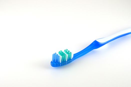 Tooth-brush over white. Shallow DOF. 