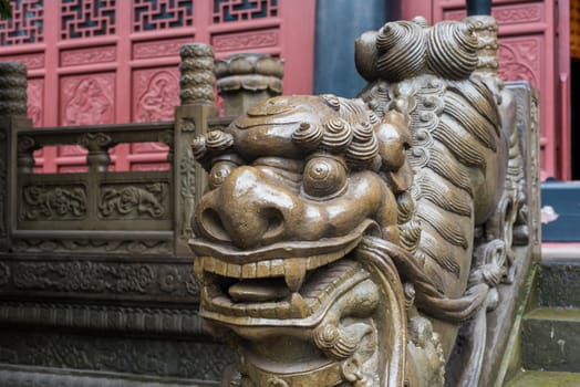 Lion stone statue on a temple stairs in Chongqing, China