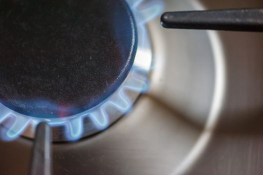 Gas flame from a stove close-up in a kitchen