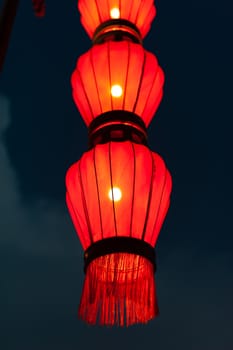 Illuminated red chinese lanterns on the fortified wall at night in Xi'an, China