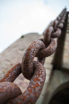 Rusty chain links close up in a castle